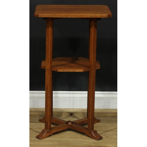 2655 - An Arts & Crafts oak occasional table, chamfered rectangular top, open undertier, X-form sledge base... 