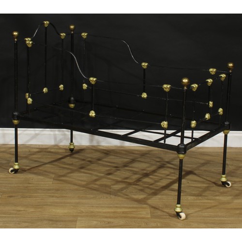 1847 - A late Victorian iron and brass child’s bed or crib, 97cm high, 123cm long, 62cm wide