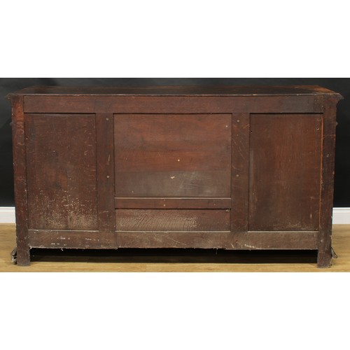 1608 - A 19th century historicist oak low dog-kennel dresser or side cabinet, rectangular top with lunette ... 