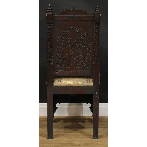 2396 - An Indo-Dutch design hardwood chair, pierced and carved throughout in the Batavian manner with meand... 