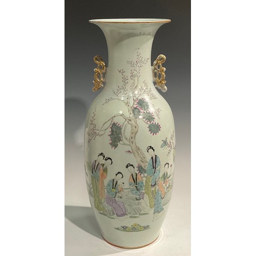 445 - A large Chinese two handled ovoid vase, painted in polychrome with ladies of the court, script to ve... 