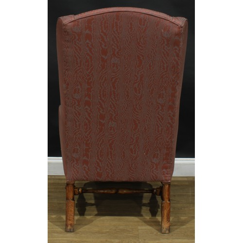 2305 - A William & Mary Revival wing chair, stuffed-over upholstery, squab cushion, turned and blocked supp... 