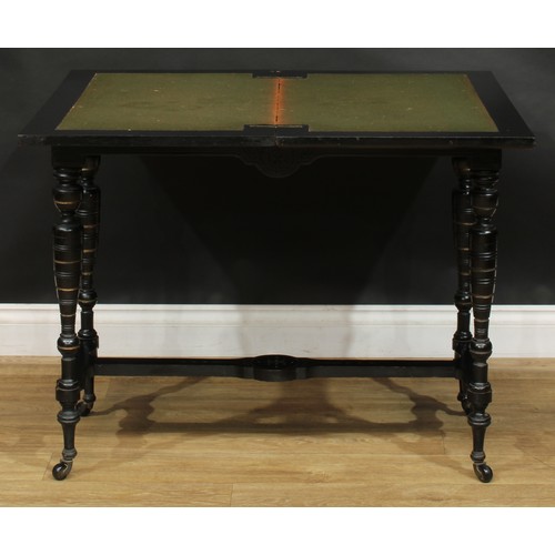 1838 - A late Victorian Aesthetic Movement amboyna and ebonised card table, hinged rectangular top enclosin... 