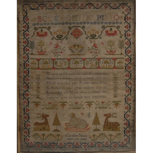 2688 - An early Victorian needlework sampler, embroidered by Caroline Nott, 1838, with alphabet, verse, dog... 