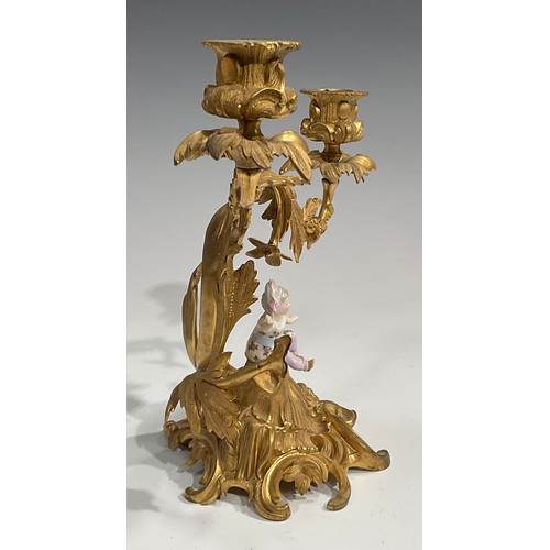 2094 - A pair of Rococo Revival gilt metal two-light candelabra, each cast with flowers and scrolling acant... 