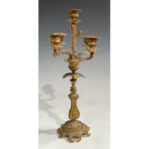 1819 - A pair of 19th century gilt metal five-light candelabra, cast throughout with acanthus in the Rococo... 