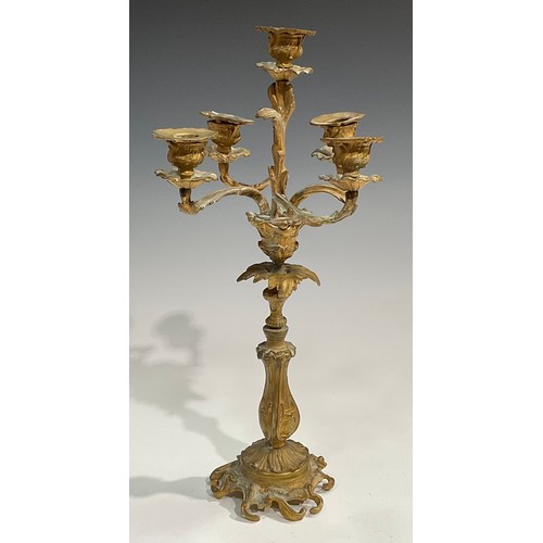 1819 - A pair of 19th century gilt metal five-light candelabra, cast throughout with acanthus in the Rococo... 