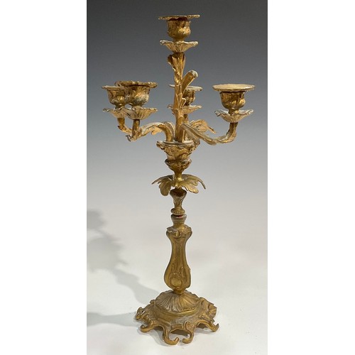 1819 - A pair of 19th century gilt metal five-light candelabra, cast throughout with acanthus in the Rococo... 