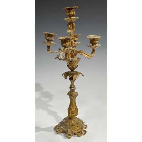 1819 - A pair of 19th century gilt metal five-light candelabra, cast throughout with acanthus in the Rococo... 