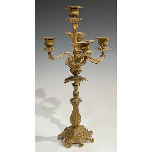 1819 - A pair of 19th century gilt metal five-light candelabra, cast throughout with acanthus in the Rococo... 