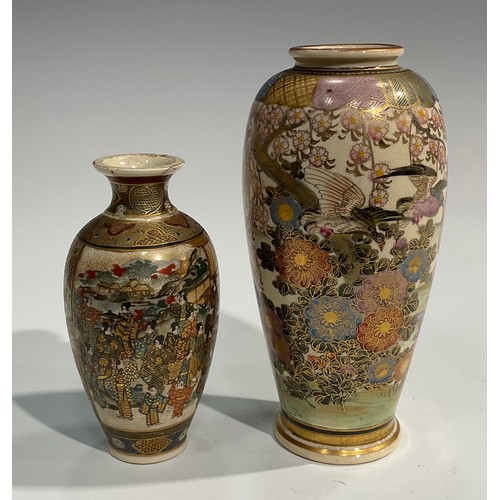 437 - A Japanese satsuma ovoid vase, painted with birds, witeria and other flowers in an extensive landsca... 