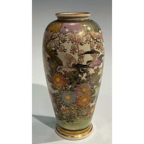 437 - A Japanese satsuma ovoid vase, painted with birds, witeria and other flowers in an extensive landsca... 