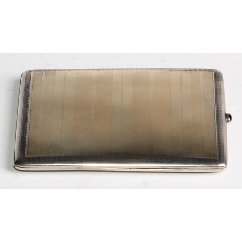 1043 - A Russian gold coloured metal overlaid silver rounded rectangular  cigarette case, engine turned, 9.... 