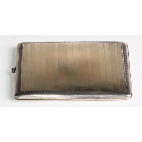 1043 - A Russian gold coloured metal overlaid silver rounded rectangular  cigarette case, engine turned, 9.... 