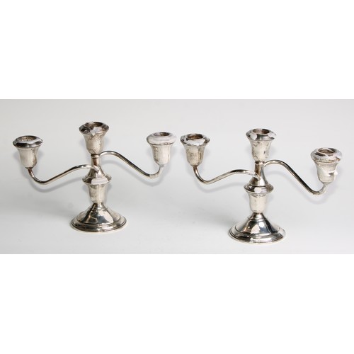 1008 - A pair of American silver three-light table candelabra, bell shaped sconces, circular bases, 24.5cm ... 