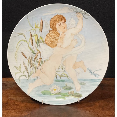 67 - An Aesthetic Movement Berlin porcelain circular charger, painted with two cherubs above a lilypond w... 