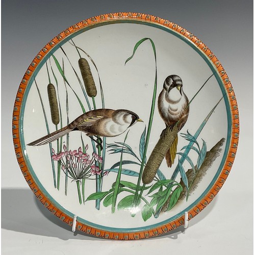 54 - A Minton's Aesthetic Movement circular dish, painted in muted tones of green and grey with an owl pe... 