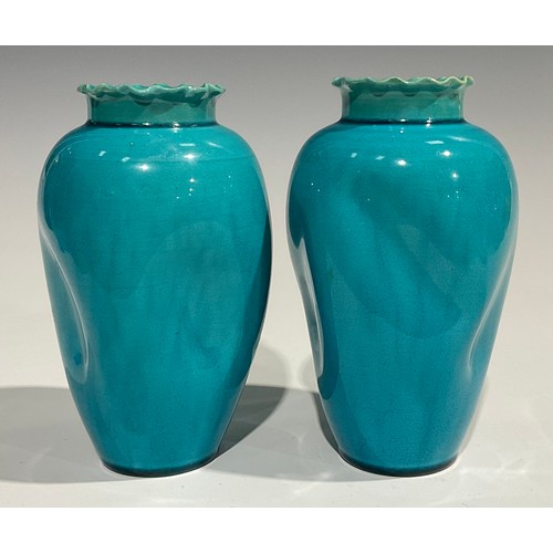 58 - A pair of Burmantofts Faience dimpled ovoid vases, flared frilled rims, glazed throughout in turquoi... 