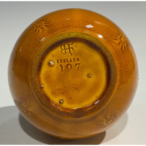 28 - A Burmantofts Faience bottle vase, the globular body applied with sgraffito sunbursts, long cylindri... 