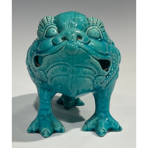 41 - A Burmantofts Faience spoon warmer, as a grotesque three-legged toad, Jin Chan Toad, glazed througho... 