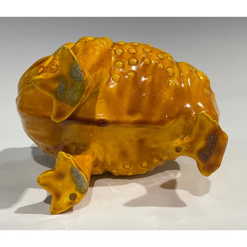 42 - A Burmantofts Faience spoon warmer, as a grotesque three-legged toad, Jin Chan Toad, glazed througho... 