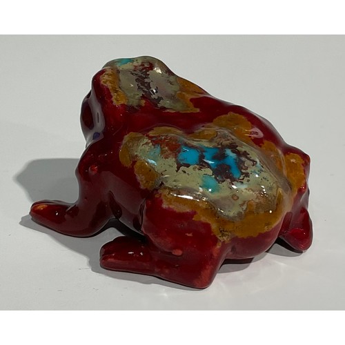 19 - A Bernard Moore flambé model, of a toad, speckled with tones of orange and turquoise, 5.5cm long, si... 