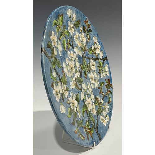 72 - An Aesthetic Movement circular charger, painted by J Edith Cowper, signed, with cherry blossom on a ... 