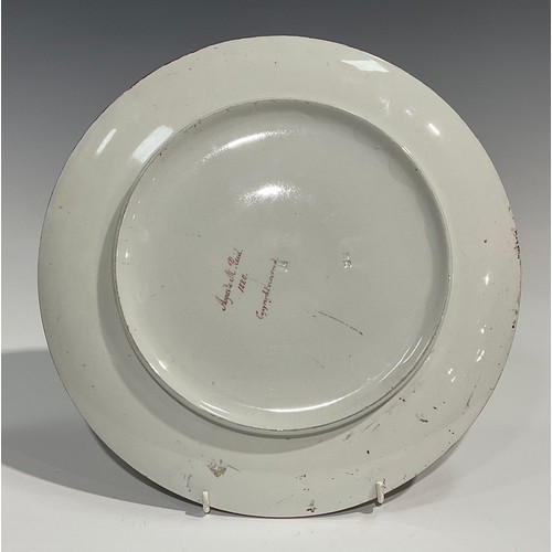 68 - An Aesthetic Movement circular charger, painted by Augusta M Reid, monogrammed AR, with stylised whi... 