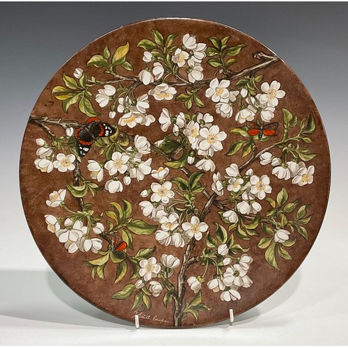 73 - An Aesthetic Movement circular charger, painted by J Edith Cowper, signed, with Red Admiral butterfl... 