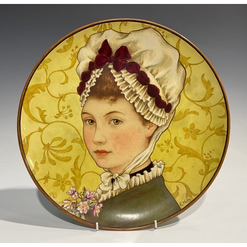 53 - A Minton Aesthetic Movement circular charger, painted by E Welby, with a portrait of a Victorian mai... 