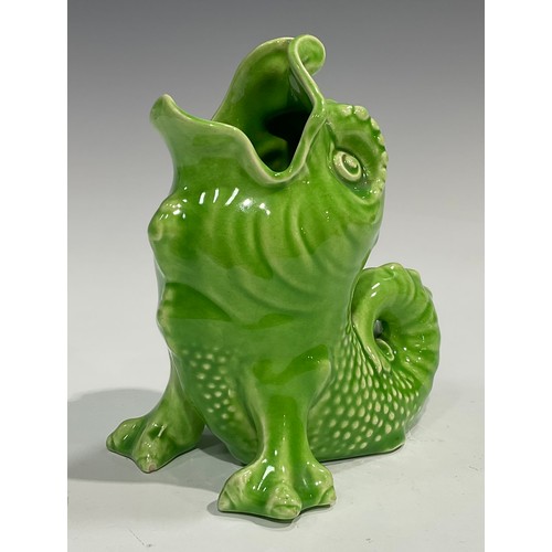 65 - A Sarreguemines spoon warmer, as a grotesques mythical sea creature, glazed throughout in green, 14.... 