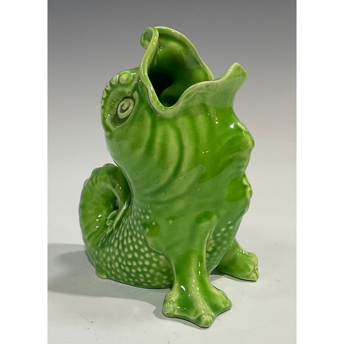 65 - A Sarreguemines spoon warmer, as a grotesques mythical sea creature, glazed throughout in green, 14.... 