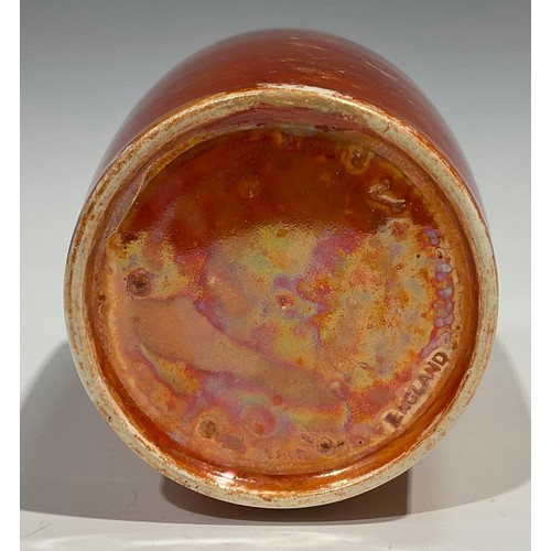 64 - A Ruskin lustre shouldered vase, glazed throughout in mottled tones of orange, 16.5cm high, impresse... 