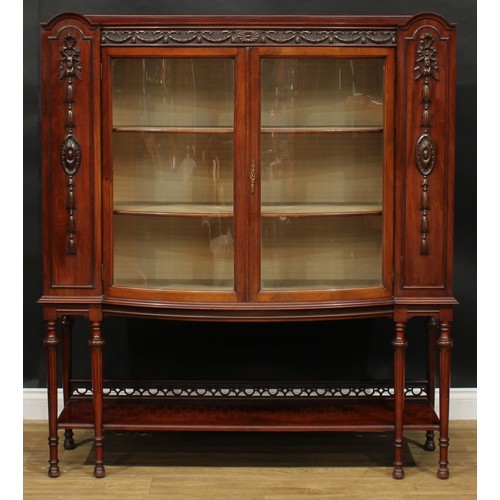 2331 - An early 20th century Adam Revival mahogany bow-centre display cabinet, shallow half-gallery above a... 