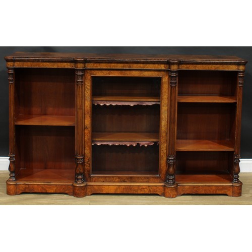 2292 - A Victorian walnut low library bookcase, slightly oversailing top with moulded edge above a glazed d... 