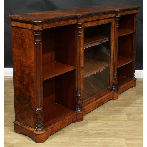 2292 - A Victorian walnut low library bookcase, slightly oversailing top with moulded edge above a glazed d... 