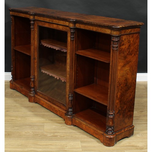 2292 - A Victorian walnut low library bookcase, slightly oversailing top with moulded edge above a glazed d... 