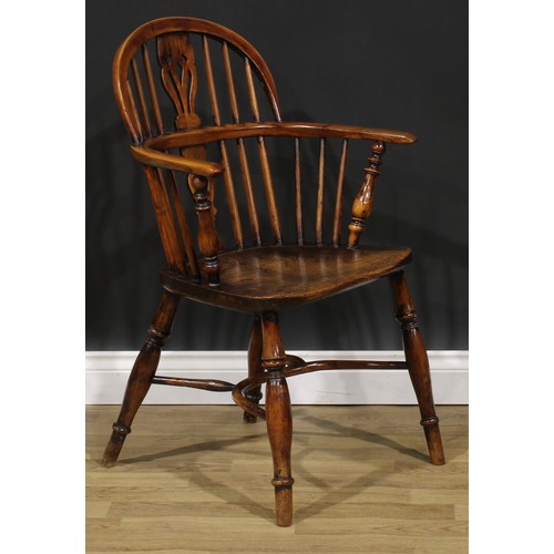 1852 - A near pair of 19th century yew and elm Windsor elbow chairs, each with a low hoop back, shaped and ... 