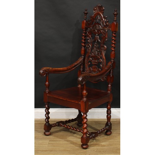 2303 - A William & Mary Revival open armchair, shaped back carved with a flowering campana urn and scrollin... 