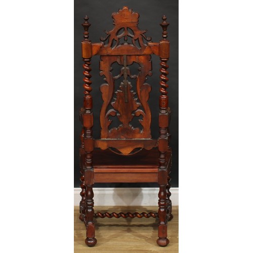 2303 - A William & Mary Revival open armchair, shaped back carved with a flowering campana urn and scrollin... 