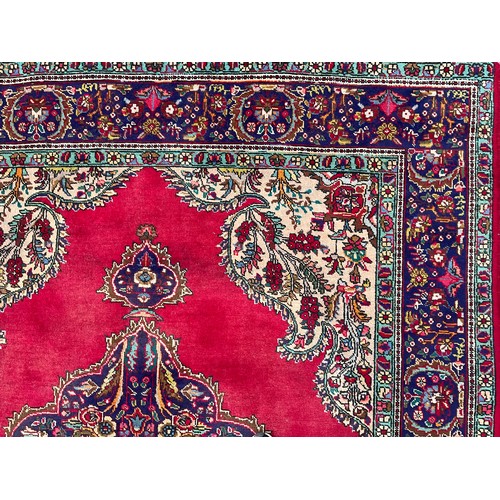 1773 - A Persian Kerman type wool rug or carpet, worked in the traditional manner, 278.5cm x 207.5cm