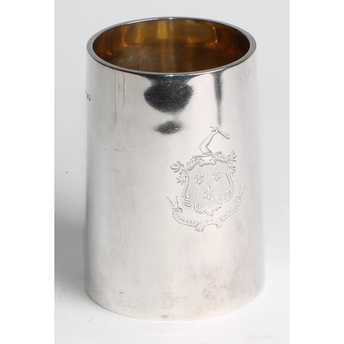 1105 - A Victorian silver spreading cylindrical pint mug,  glass base, gilt interior, engraved heraldry and... 