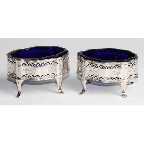 1212 - Hester Bateman - a pair of George III silver serpentine salts, pierced, bright-cut engraved cand out... 