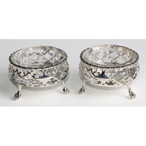 1031 - A pair of large early George III silver salts, gadrooned and pierced borders, ball and claw feet, as... 