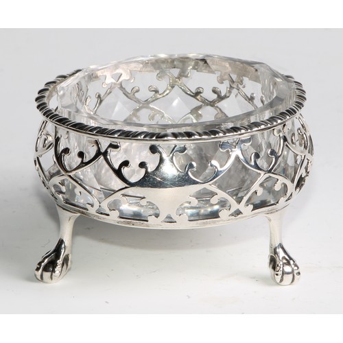 1031 - A pair of large early George III silver salts, gadrooned and pierced borders, ball and claw feet, as... 