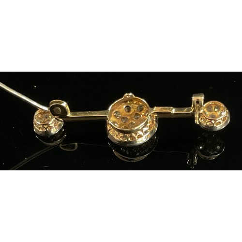 1366 - A diamond brooch, three rounded pave set diamond panels, divided by razor bar links, total estimated... 