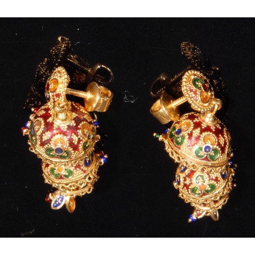 1430 - A pair of gold coloured metal and enamel drop earrings, the four graduating bell shaped tiers each t... 