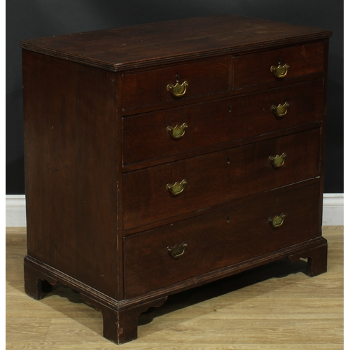 1943 - A George III oak chest, rectangular top with reeded edge above two short and three long graduated dr... 