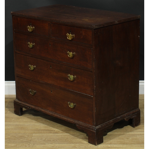 1943 - A George III oak chest, rectangular top with reeded edge above two short and three long graduated dr... 