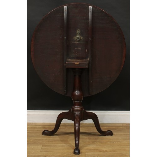 1742 - A George III mahogany tripod occasional table, one-piece circular tilting top, turned column, cabrio... 